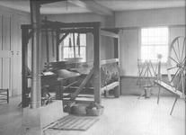 SA0485 - Photo shows a loom, wool wheel, stove, and yarn winder. Identified on the back.